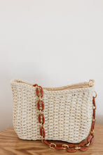 Load image into Gallery viewer, weekend getaway bag in the color cream. bag is shown with the acrylic and chain strap attached.