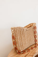 Load image into Gallery viewer, weekend getaway bag in the color tan. bag is shown with the acrylic and metal chain attached.