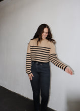 Load image into Gallery viewer, model wearing the where to start sweater. model has the sweater paired with a pair of black denim.