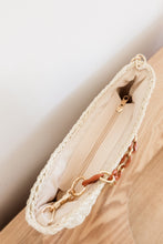 Load image into Gallery viewer, weekend getaway bag in the color cream. bag is shown with the acrylic and chain strap attached.