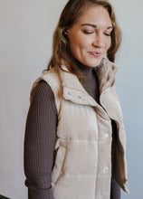 Load image into Gallery viewer, model wearing the what could have been vest in the color khaki. model has the vest paired with the can&#39;t get enough top in the color brown and a pair of dark wash jeans.