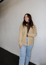 Load image into Gallery viewer, model wearing the right where you left me shacket in the color khaki. model has the shacket paired with the can&#39;t get enough top in the color brown and a pair of light wash denim.