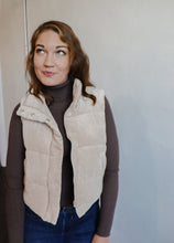 Load image into Gallery viewer, model wearing the what could have been vest in the color khaki. model has the vest paired with the can&#39;t get enough top in the color brown and a pair of dark wash jeans.