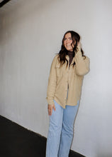 Load image into Gallery viewer, model wearing the right where you left me shacket in the color khaki. model has the shacket paired with the can&#39;t get enough top in the color brown and a pair of light wash denim.
