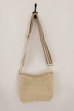 Load image into Gallery viewer, weekend getaway bag in the color cream. bag is shown with the crossbody canvas strap attached.