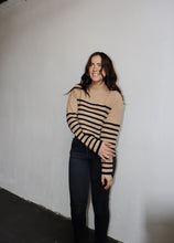 Load image into Gallery viewer, model wearing the where to start sweater. model has the sweater paired with a pair of black denim.