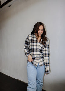 model wearing the up north flannel paired with a pair of light wash denim.