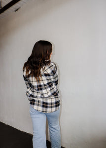 model wearing the up north flannel paired with a pair of light wash denim.