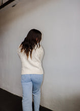 Load image into Gallery viewer, model wearing the long ago sweater. model has the sweater paired with the can&#39;t get enough top in the color brown and a pair of light wash denim.