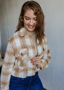 model wearing the patiently waiting shacket. model has the shacket paired with the can't get enough top in the color oatmeal and a pair of dark wash denim.
