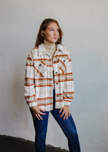 Load image into Gallery viewer, model wearing the suddenly I see shacket in the color terra plaid. model has the shacket paired with the can&#39;t get enough top in the color oatmeal and a pair of dark wash denim.
