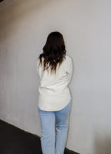 Load image into Gallery viewer, model wearing the right where you left me shacket in the color cream. model has the shacket paired with the can&#39;t get enough top in the color brown and a pair of light wash denim.