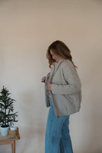 Load image into Gallery viewer, side view of model wearing the one more day jacket. model has the sweater paired with the genevive denim.