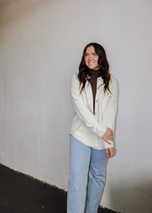 model wearing the right where you left me shacket in the color cream. model has the shacket paired with the can't get enough top in the color brown and a pair of light wash denim.