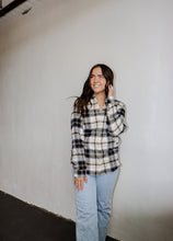 Load image into Gallery viewer, model wearing the up north flannel paired with a pair of light wash denim.