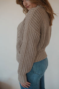 detail view of model wearing the finally yours sweater. model has the sweater paired with the lawson denim.