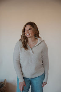 front view of model wearing the seems so simple sweater. model has the sweater paired with the augustine denim.