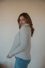 Load image into Gallery viewer, side view of model wearing the seems so simple sweater. model has the sweater paired with the augustine denim.