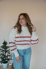 Load image into Gallery viewer, front view of model wearing the winter wonderland sweater. model has the sweater paired with the genevive denim.