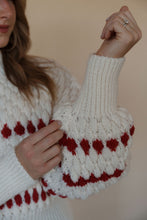 Load image into Gallery viewer, detail view of model wearing the winter wonderland sweater. model has the sweater paired with the genevive denim.