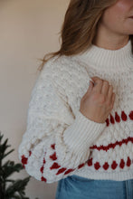 Load image into Gallery viewer, detail view of model wearing the winter wonderland sweater. model has the sweater paired with the genevive denim.