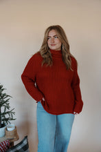 Load image into Gallery viewer, front view of model wearing the patiently waiting sweater. model has the sweater paired with the genevive denim.