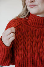 Load image into Gallery viewer, detail view of model wearing the patiently waiting sweater. model has the sweater paired with the genevive denim.