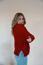 Load image into Gallery viewer, side view of model wearing the patiently waiting sweater. model has the sweater paired with the genevive denim.