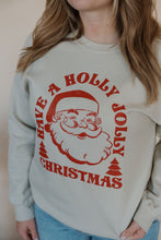 Load image into Gallery viewer, detail view of model wearing the holly jolly crewneck sweatshirt. model has the sweatshirt paired with the genevive denim.