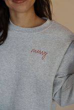 Load image into Gallery viewer, detail view of model wearing the merry crewneck sweatshirt. 