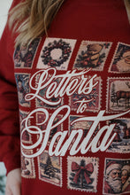 Load image into Gallery viewer, detail view of model wearing the letters to santa crewneck sweatshirt. model has the sweatshirt paired with the genevive denim.