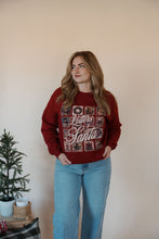 Load image into Gallery viewer, front view of model wearing the letters to santa crewneck sweatshirt. model has the sweatshirt paired with the genevive denim.