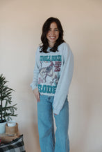 Load image into Gallery viewer, front view of model wearing the jingle horse rodeo crewneck sweatshirt.