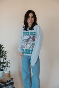 front view of model wearing the jingle horse rodeo crewneck sweatshirt.