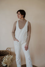 Load image into Gallery viewer, front view of model wearing the clara denim jumpsuit in cream.