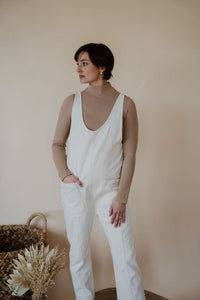 front view of model wearing the clara denim jumpsuit in cream.
