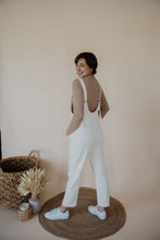 Load image into Gallery viewer, back view of model wearing the clara denim jumpsuit in denim.
