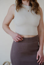 Load image into Gallery viewer, detail view of model wearing the long live skirt in the color mocha. model has the skirt paired with the forever yours top in the color light beige.
