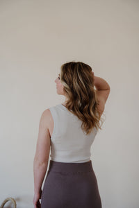 back view of model wearing the forever yours top in the color light beige.