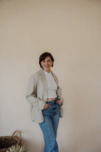 Load image into Gallery viewer, side view of model wearing the new chapter blazer. model has the blazer paired with the never hesitate top in the color white and the aurora denim.