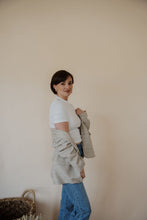 Load image into Gallery viewer, side view of model wearing the new chapter blazer. model has the blazer paired with the never hesitate top in the color white and the aurora denim.