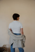 Load image into Gallery viewer, back view of model wearing the new chapter blazer. model has the blazer paired with the never hesitate top in the color white and the aurora denim.