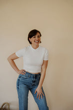 Load image into Gallery viewer, front view of model wearing the never hesitate top in the color white. model has the top paired with the aurora denim.