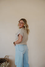 Load image into Gallery viewer, side view of model wearing the nothing to prove top in the color natural. model has the top paired with thistle + elm&#39;s camden denim.