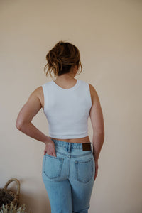 back view of model wearing the forever yours tank in the color white.