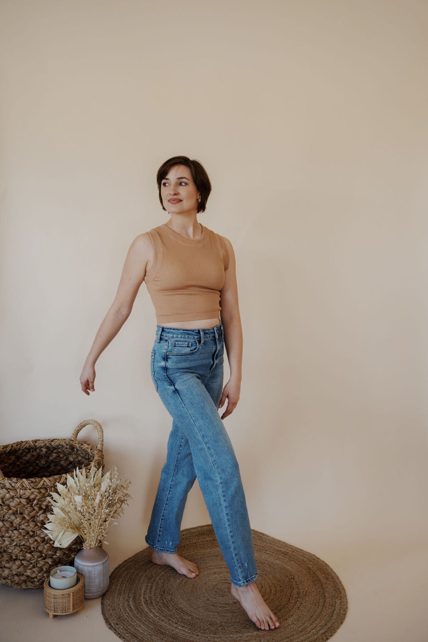 front view of model wearing the aurora denim. model has the denim paired with the forever yours tank in the color macchiato.