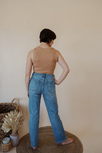 back view of model wearing the aurora denim. model has the denim paired with the forever yours tank in the color macchiato.