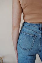 Load image into Gallery viewer, close-up back view of model wearing the aurora denim. model has the denim paired with the forever yours tank in the color macchiato.