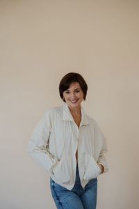 front view of model wearing the cherish the moment jacket in the color white dove. model has the jacket paired with the forever yours top in the color macchiato and the aurora denim.