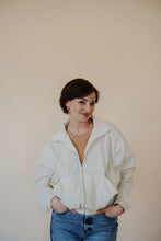 Load image into Gallery viewer, front view of model wearing the cherish the moment jacket in the color white dove. model has the jacket paired with the forever yours top in the color macchiato and the aurora denim.